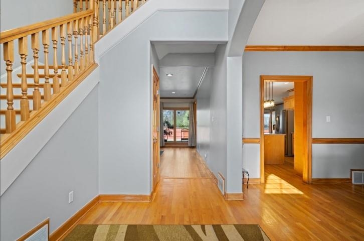 1385 Winoka Road Collierville, TN 38017 - Photo 2 of 16 a view of a hallway with wooden floor and staircase