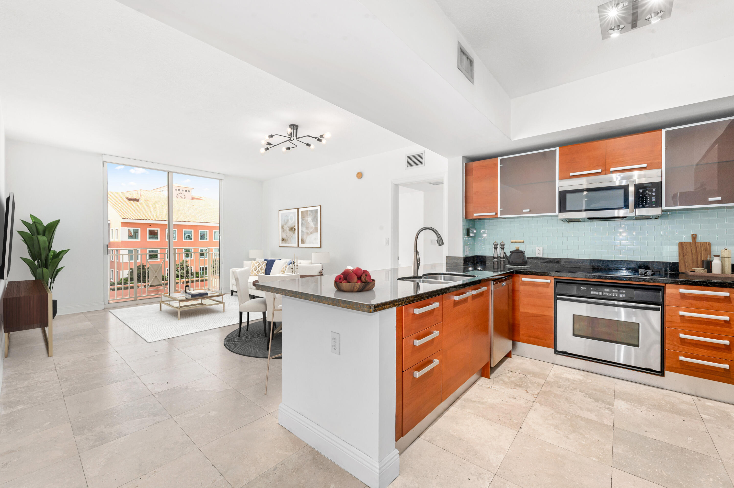 2030 Douglas Road, Unit 807 Coral Gables, FL 33134 - Photo 4 of 12 a kitchen with stainless steel appliances granite countertop a stove and cabinets
