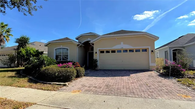 a front view of a house with yard