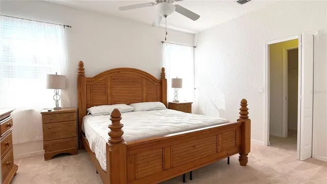 a bedroom with bed and window