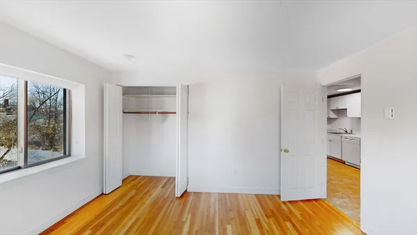 a view of a room with wooden floor and walls