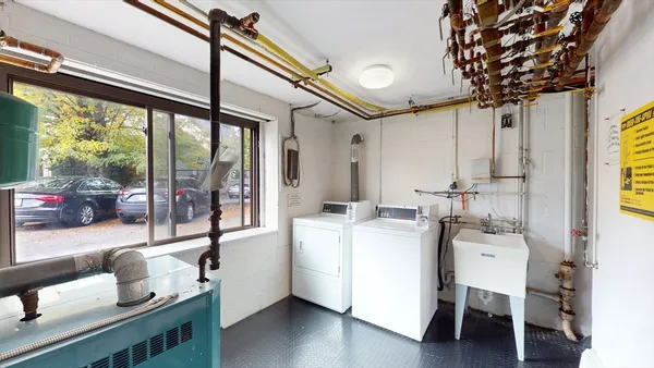 a room with furniture and a large window