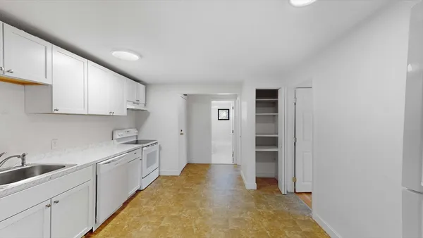 a kitchen with cabinets and sink