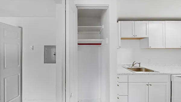 a kitchen with a sink and cabinets