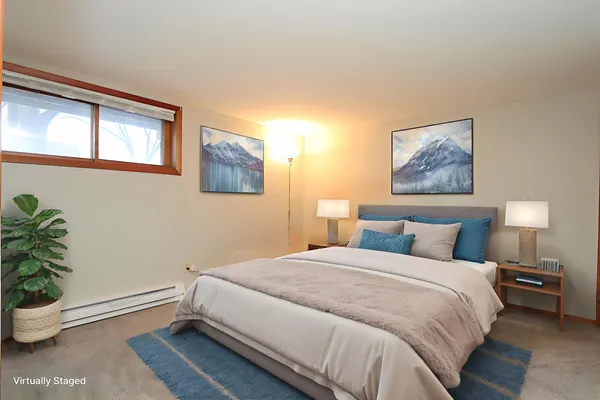 a room with a bed and a window