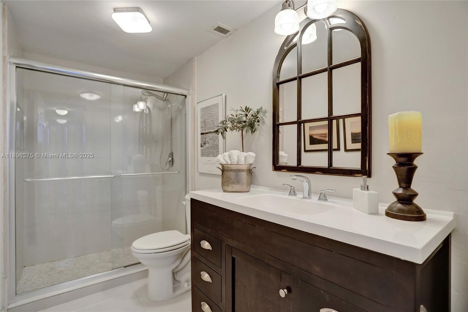 500 Bayview Drive, Unit 731 Sunny Isles Beach, FL 33160 - Photo 20 of 46 a bathroom with a sink a toilet and shower