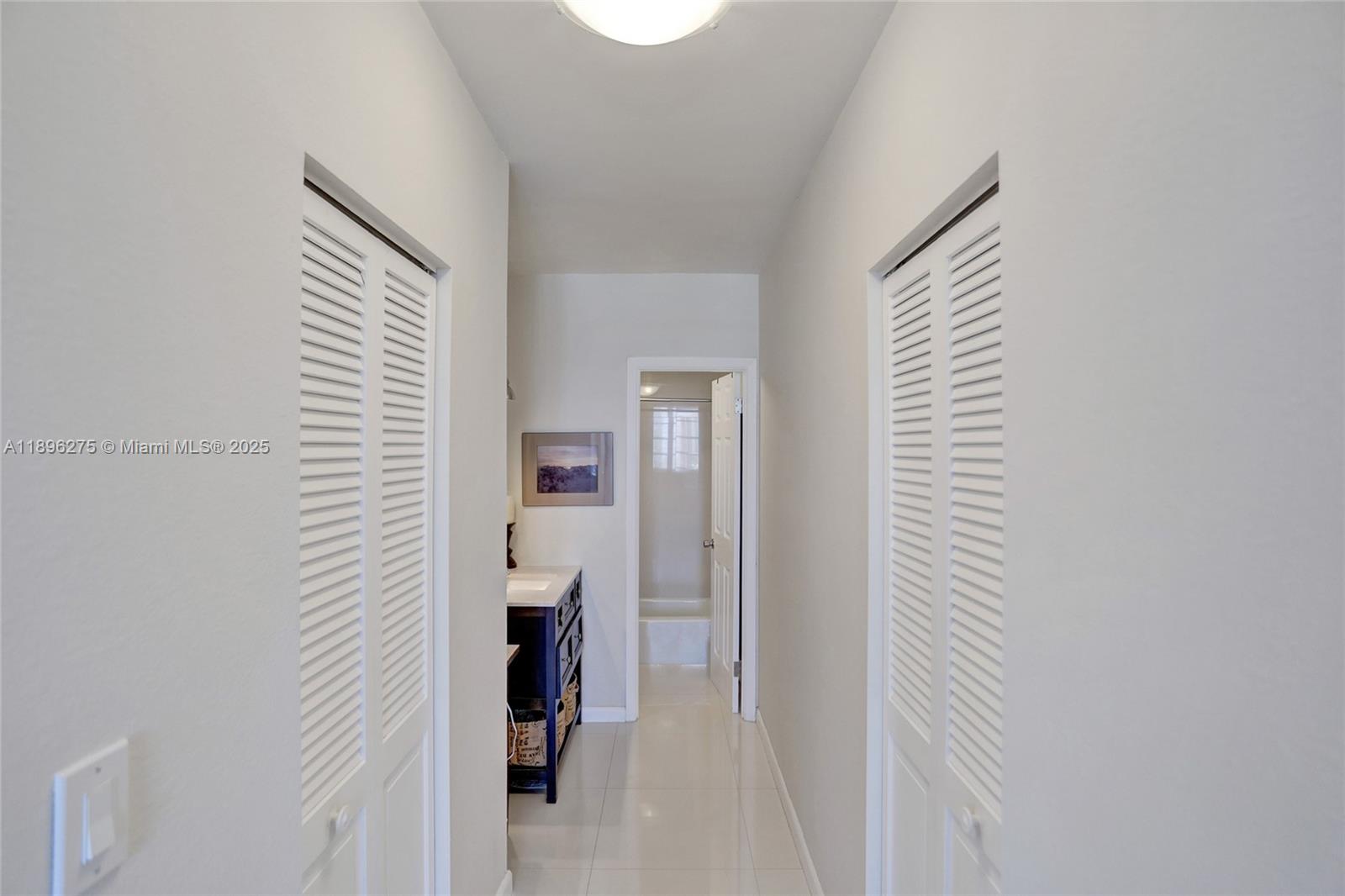 500 Bayview Drive, Unit 731 Sunny Isles Beach, FL 33160 - Photo 24 of 46 a view of a hallway with closet and a window