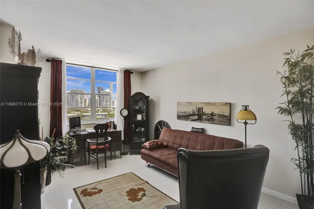 a living room with furniture gym equipment and large windows