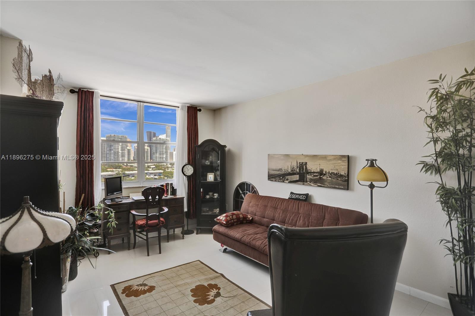 500 Bayview Drive, Unit 731 Sunny Isles Beach, FL 33160 - Photo 26 of 46 a living room with furniture and a floor to ceiling window