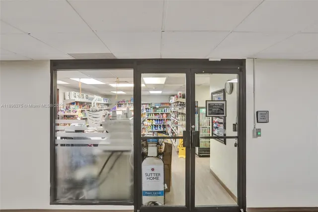 a building with potted plants in front of it