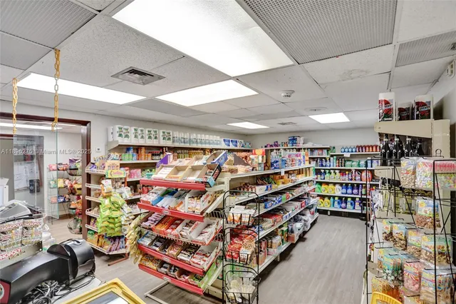 a picture of a building with a garden and plants