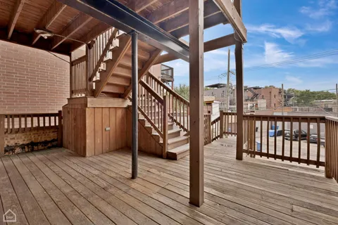 a view of entryway with wooden floor and fence
