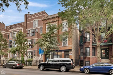 a car parked in front of a buildings