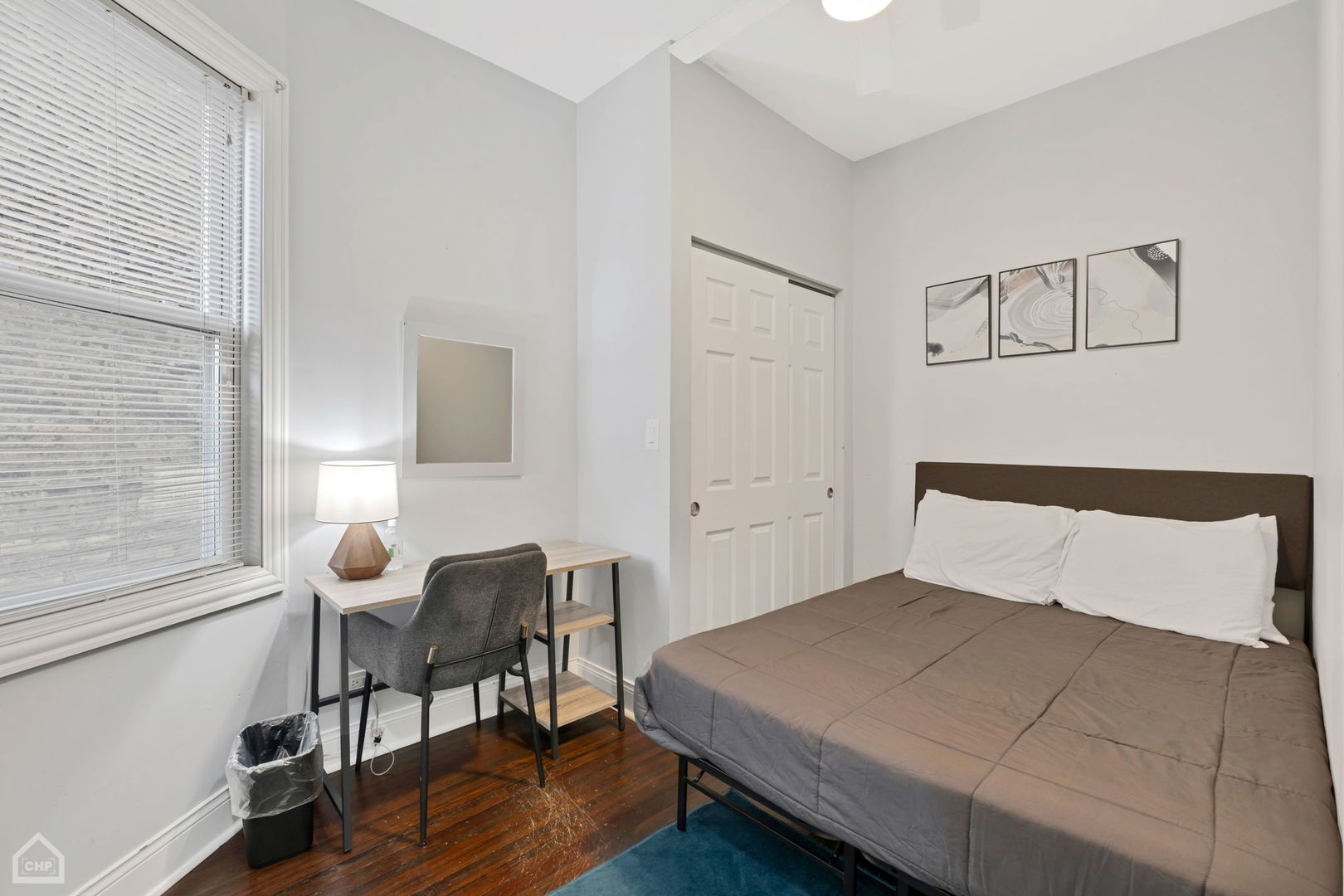 3824 North Clark Street Chicago, IL 60613 - Photo 8 of 16 a bedroom with a bed and a lamp on table