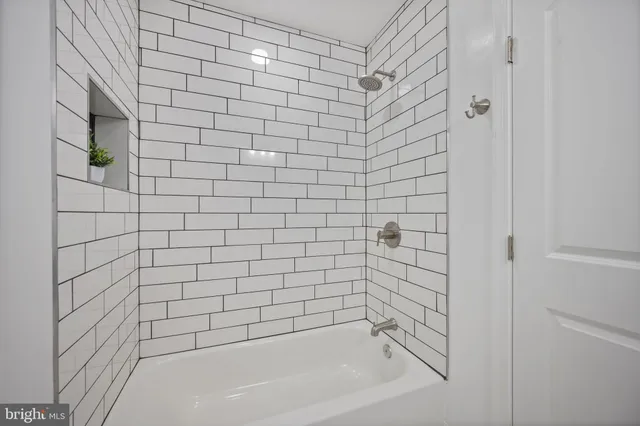 a bathroom with a sink vanity and mirror