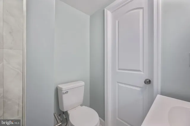 a picture of a bench in a white building