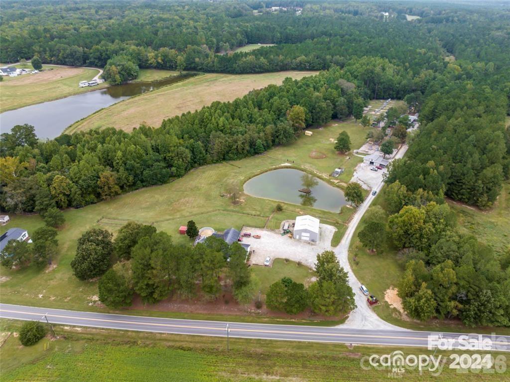 10560 Lake Royalle Road Spring Hope, NC 27882 - Photo 2 of 37 a view of a swimming pool with a yard