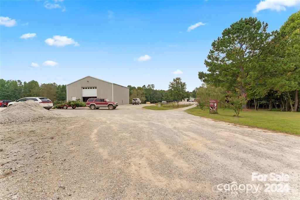 10560 Lake Royalle Road Spring Hope, NC 27882 - Photo 26 of 37 a view of road with card and trees