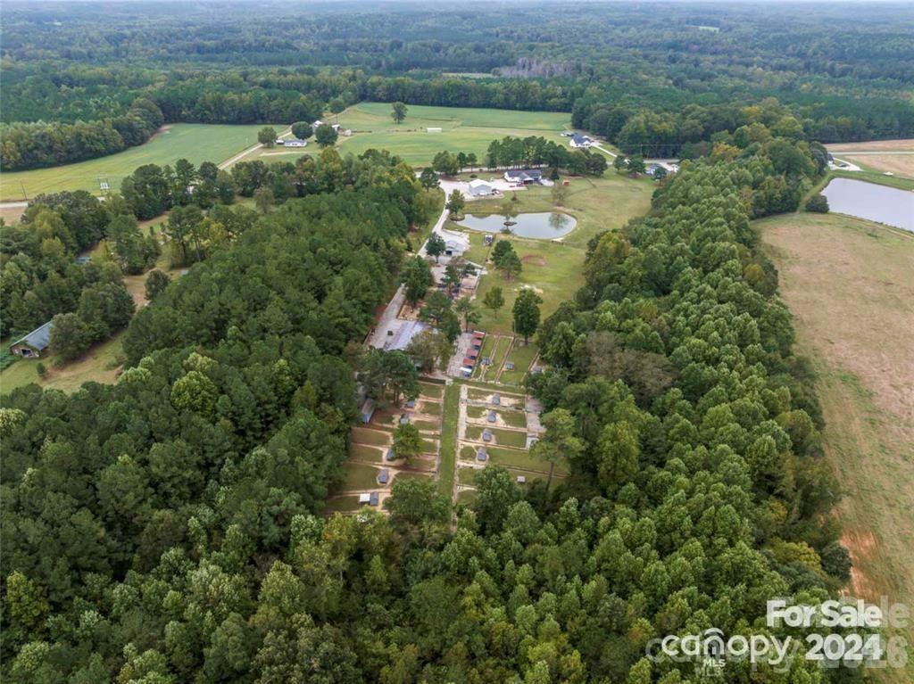 10560 Lake Royalle Road Spring Hope, NC 27882 - Photo 30 of 37 an aerial view of residential houses with outdoor space and trees