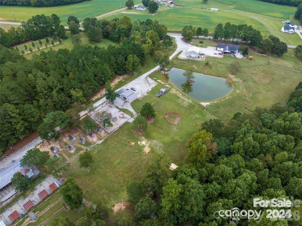 10560 Lake Royalle Road Spring Hope, NC 27882 - Photo 3 of 37 a view of a lake with huge green field