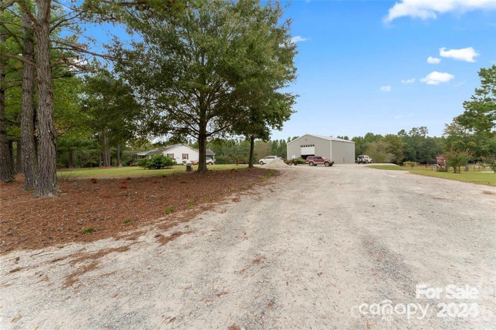 10560 Lake Royalle Road Spring Hope, NC 27882 - Photo 31 of 37 a view of a yard with a tree