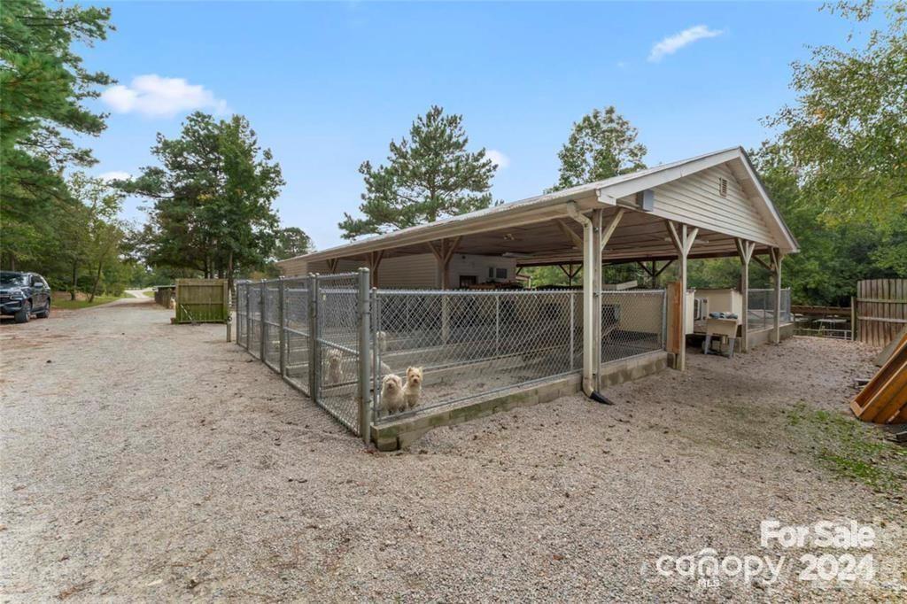 10560 Lake Royalle Road Spring Hope, NC 27882 - Photo 34 of 37 a view of a barn with a yard
