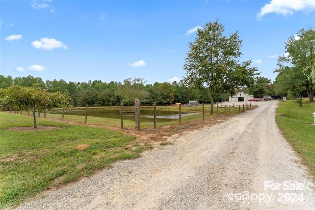 10560 Lake Royalle Road Spring Hope, NC 27882 - Photo 7 of 37 a view of a golf course with a lake