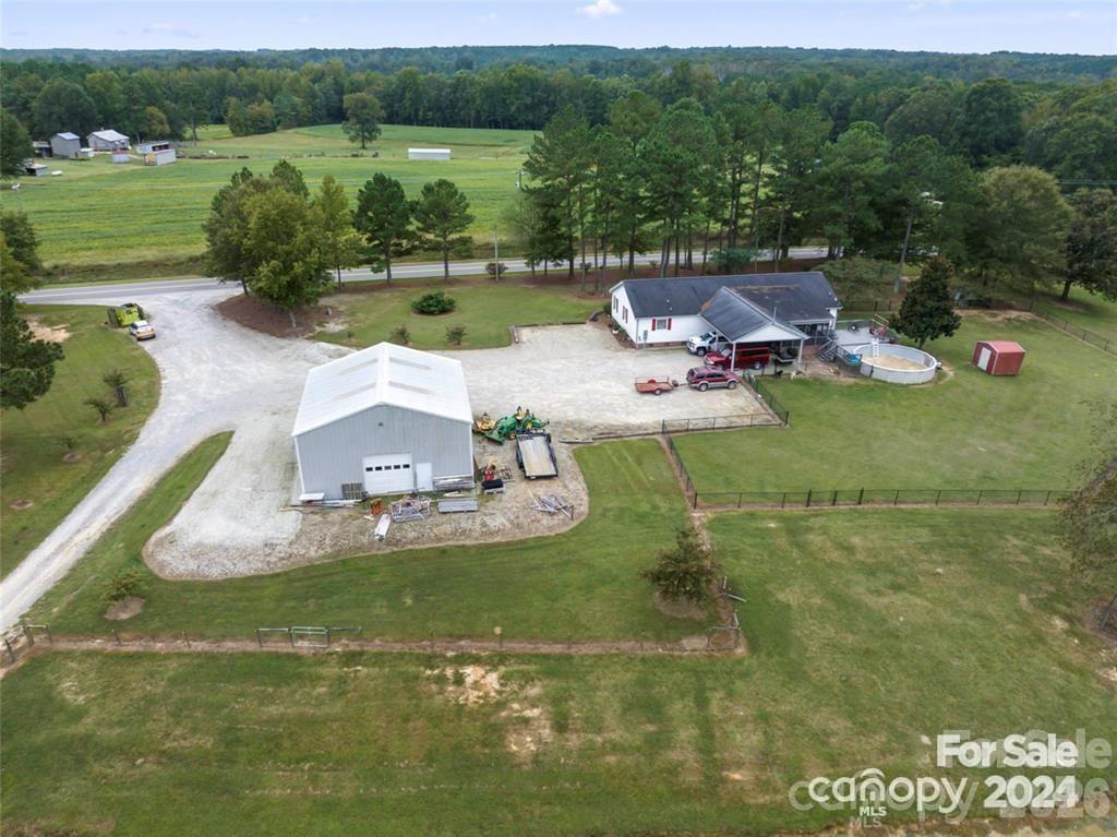 10560 Lake Royalle Road Spring Hope, NC 27882 - Photo 8 of 37 an aerial view of a house with a yard basket ball court and outdoor seating