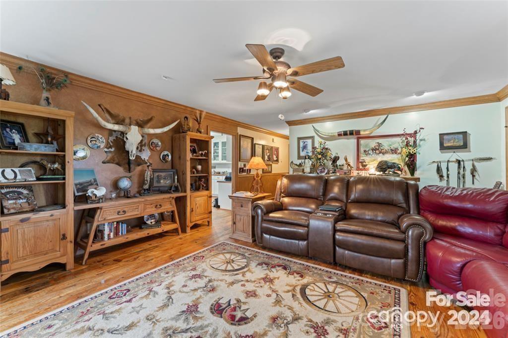 10560 Lake Royalle Road Spring Hope, NC 27882 - Photo 9 of 37 a living room with furniture and a rug