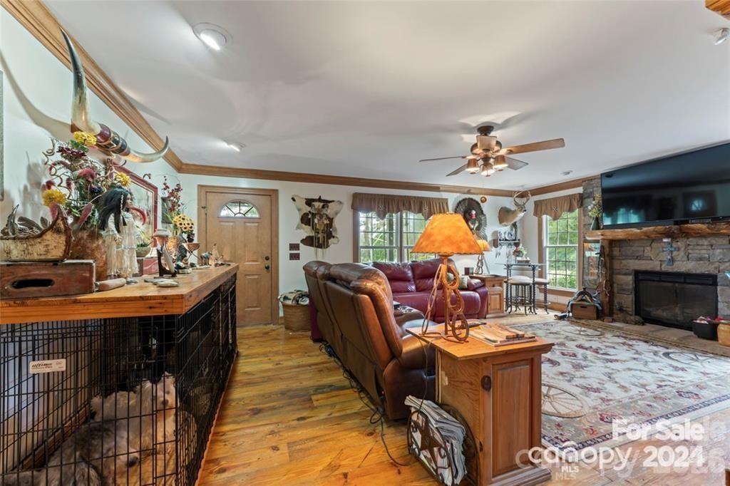 10560 Lake Royalle Road Spring Hope, NC 27882 - Photo 10 of 37 a living room with fireplace furniture and a fireplace