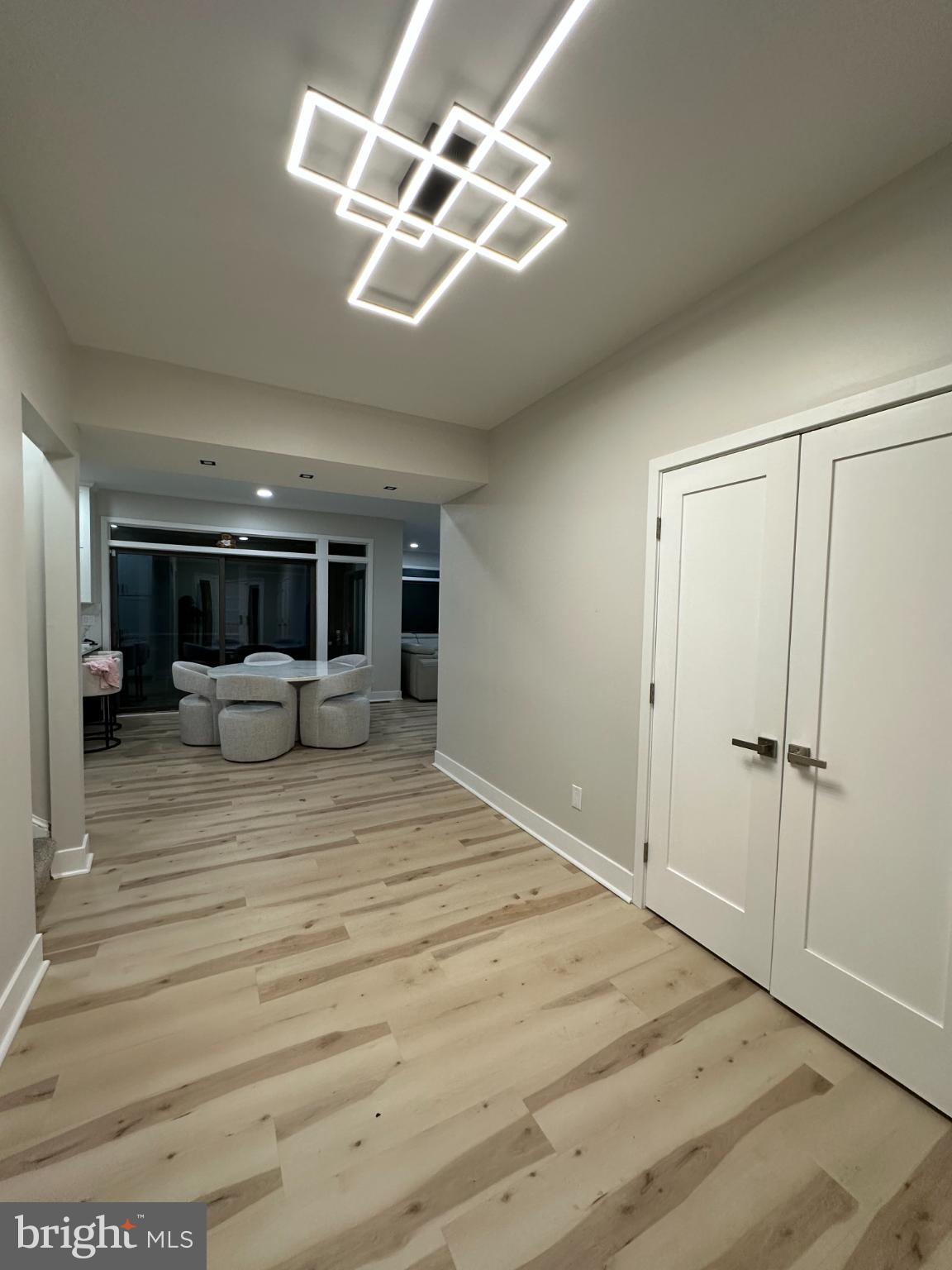 11530 Magnolia Court Issue, MD 20645 - Photo 12 of 31 a bedroom with a large bed and a chandelier