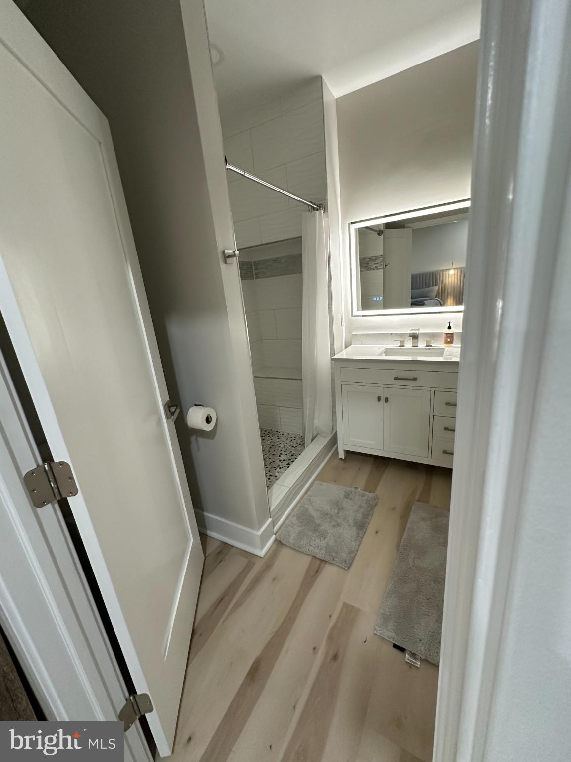 11530 Magnolia Court Issue, MD 20645 - Photo 15 of 31 a bathroom with a sink and mirror