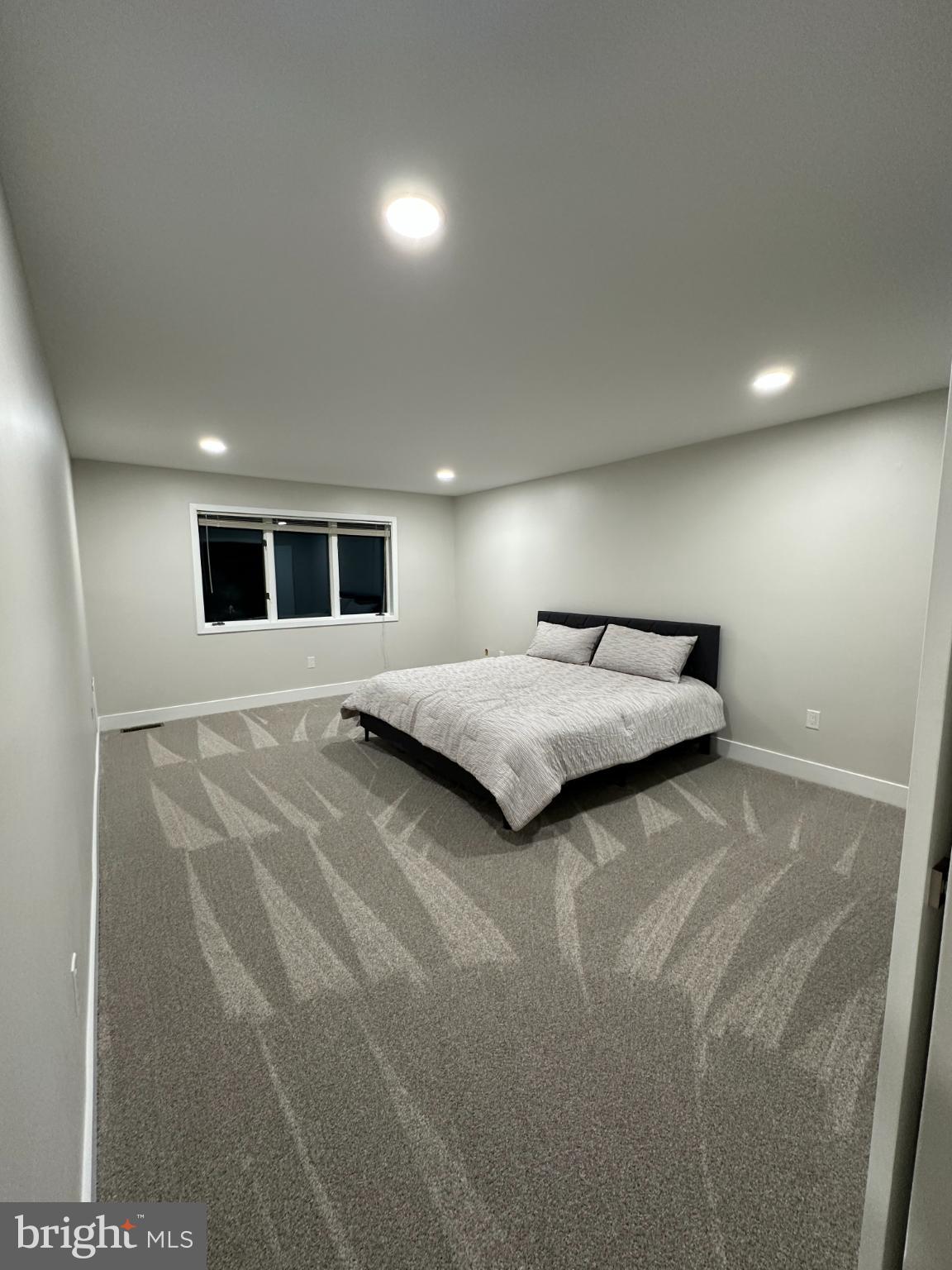 11530 Magnolia Court Issue, MD 20645 - Photo 21 of 31 a spacious bedroom with a bed and a window