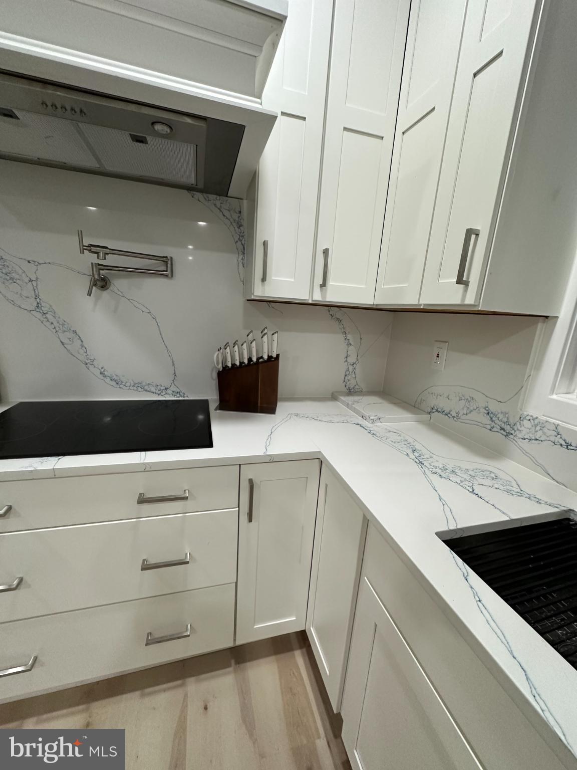 11530 Magnolia Court Issue, MD 20645 - Photo 5 of 31 a kitchen with a sink and cabinets