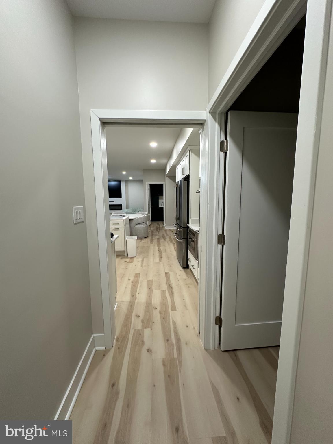 11530 Magnolia Court Issue, MD 20645 - Photo 9 of 31 a view of a hallway with wooden floor and a bathroom