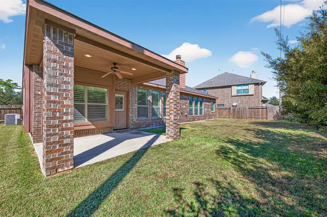 a view of a house with a yard porch and sitting area