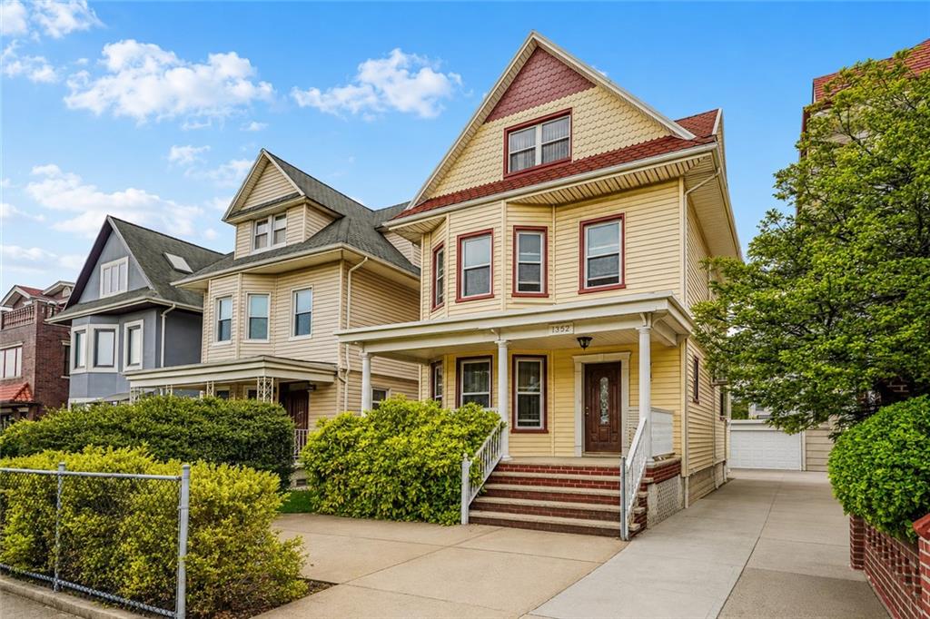 1352 Bay Ridge Parkway Brooklyn, NY 11228 - Photo 2 of 42 a front view of a house with garden