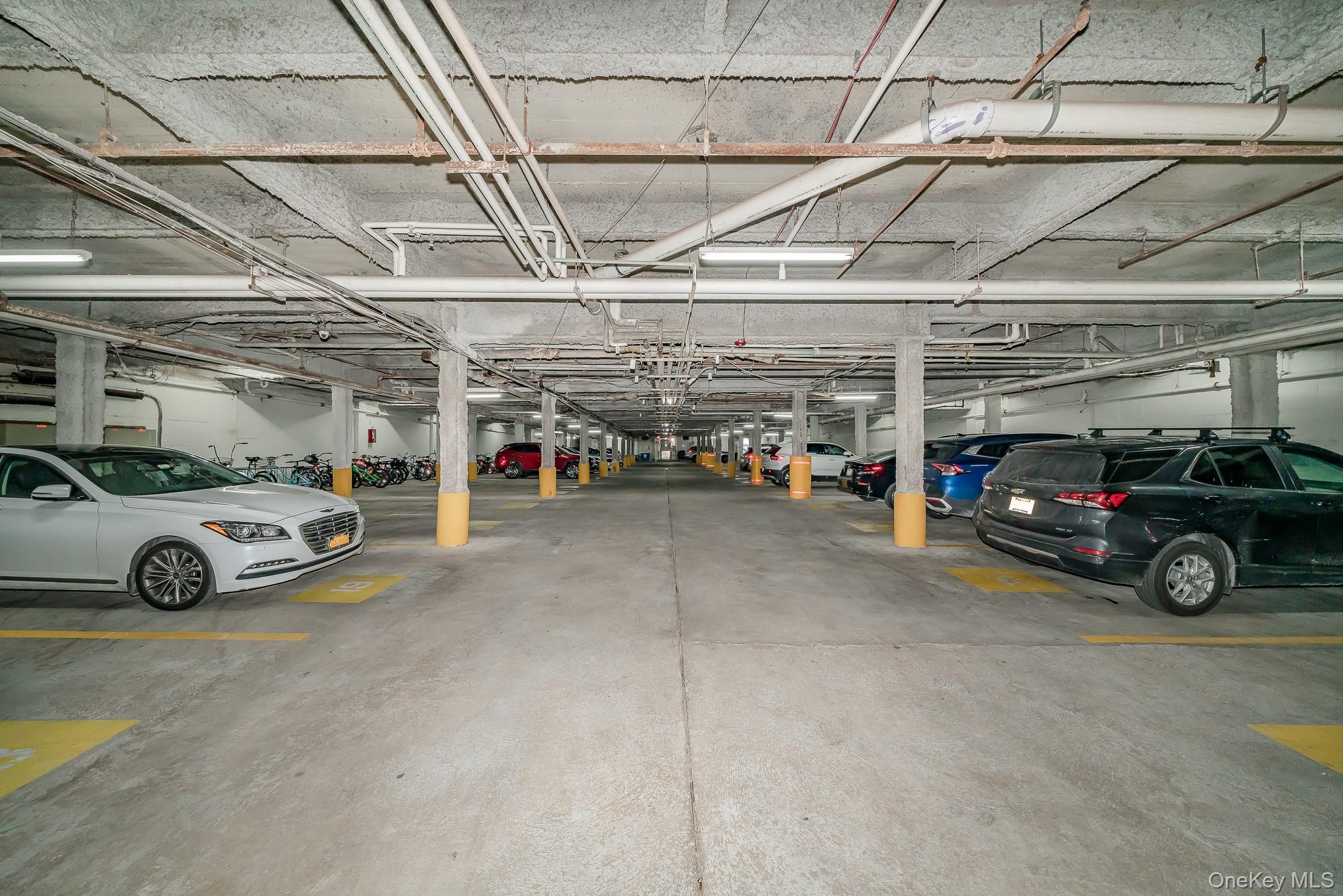 420 Shore Road, Unit 4C Long Beach, NY 11561 - Photo 25 of 41 a view of parking garage with cars