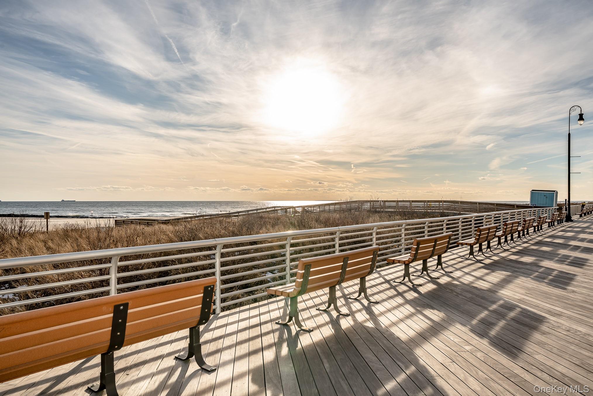 420 Shore Road, Unit 4C Long Beach, NY 11561 - Photo 38 of 41 a view of a balcony with wooden floor next to a city view