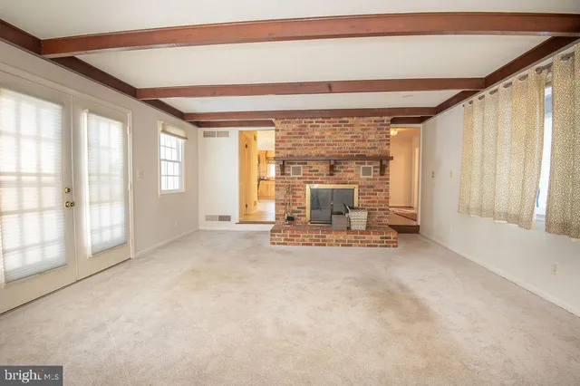 a view of living room with furniture and floor to ceiling window