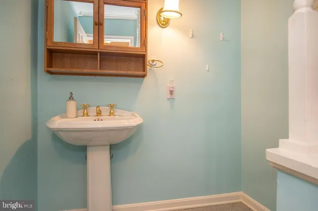 a bathroom with a sink and mirror