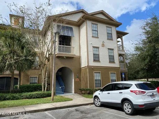 a view of a car parked in front of a building