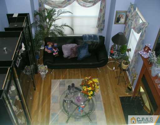 151 Salem Road North Brunswick, NJ 08902 - Photo 5 of 8 a living room with furniture and a fireplace