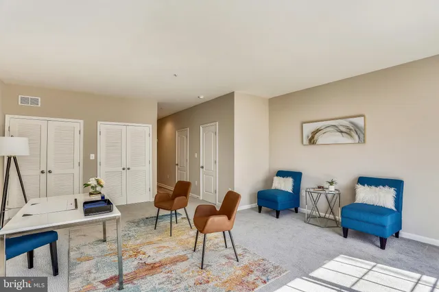 a living room with furniture and rug