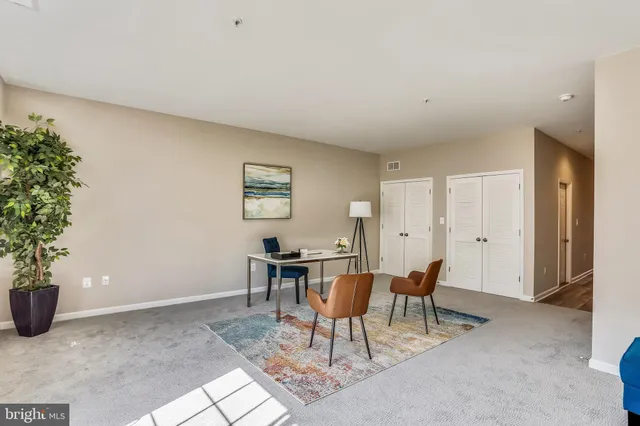 a workspace with furniture and window