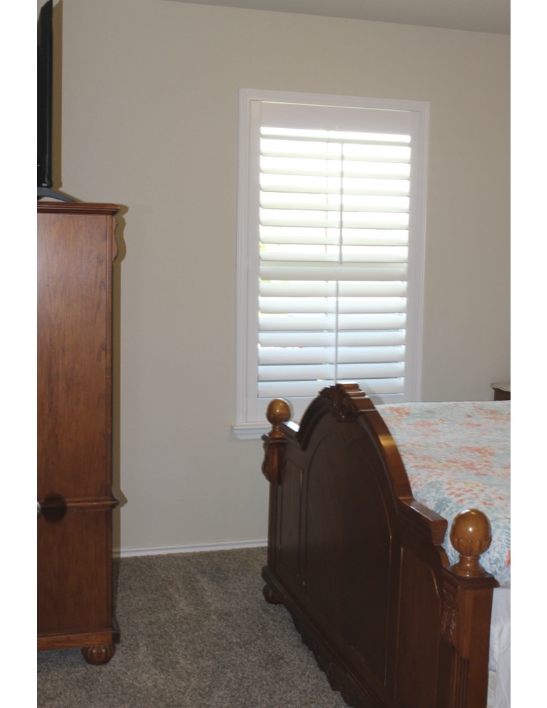 188 Beth Ann Loop Taylor, TX 76574 - Photo 8 of 12 A window with plantation shutters offers privacy in this restful bedroom retreat.