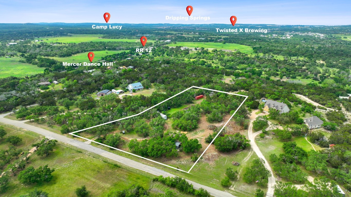 385 Country Lane Dripping Springs, TX 78620 - Photo 1 of 27 a view of a tennis court