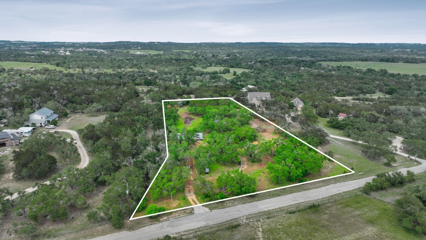 385 Country Lane Dripping Springs, TX 78620 - Photo 12 of 28 a view of a forest from a balcony