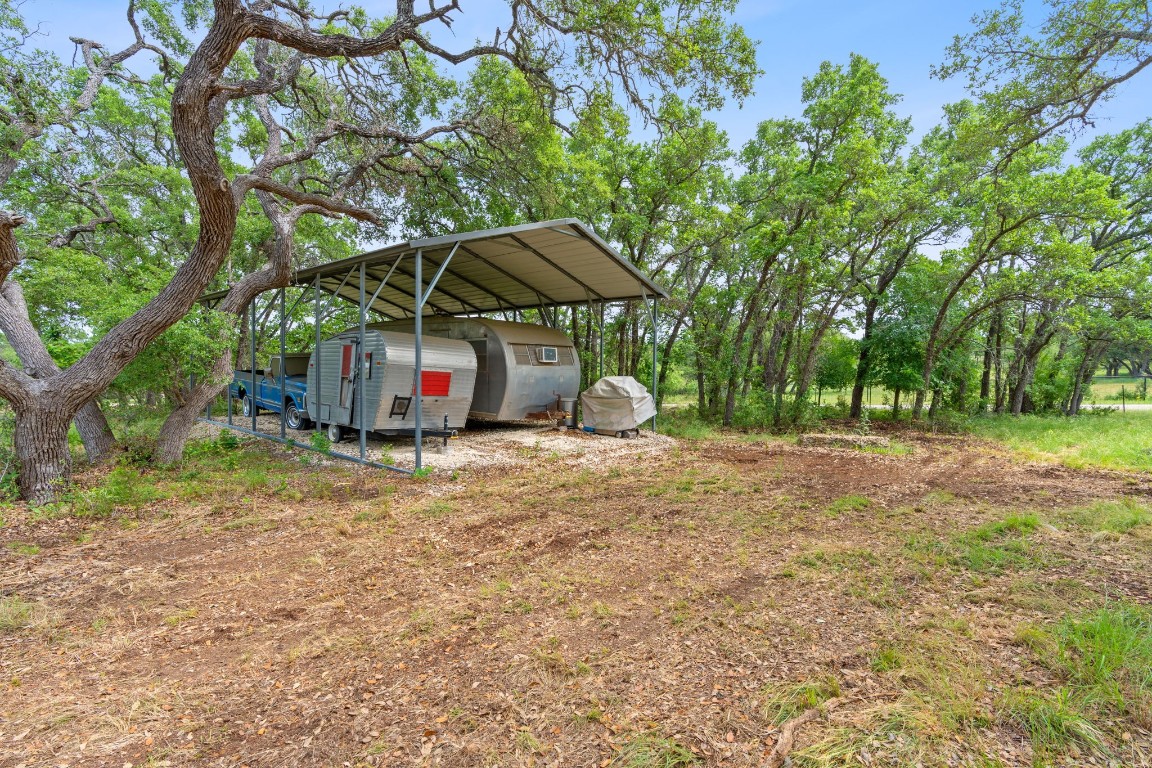 385 Country Lane Dripping Springs, TX 78620 - Photo 14 of 28 a house view with a backyard space
