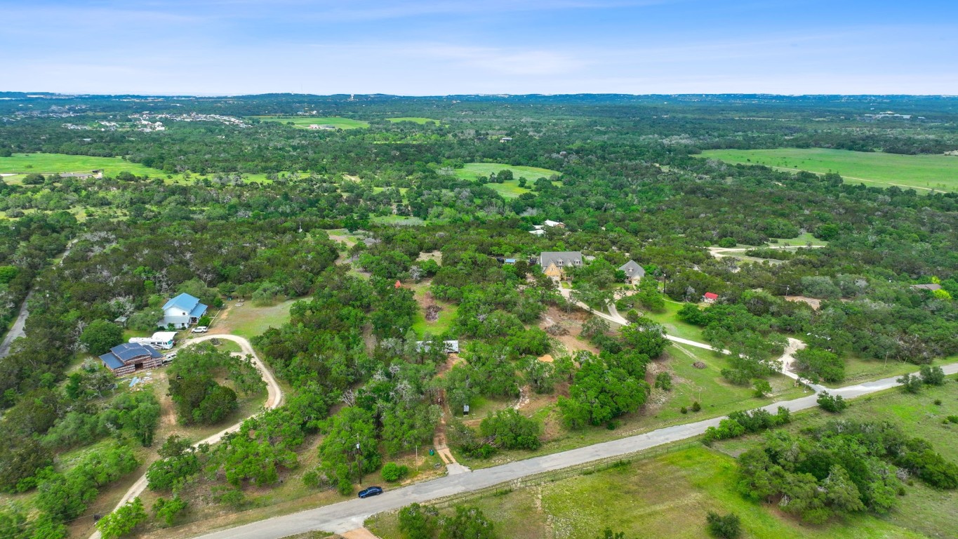 385 Country Lane Dripping Springs, TX 78620 - Photo 25 of 27 a view of a big yard with large trees